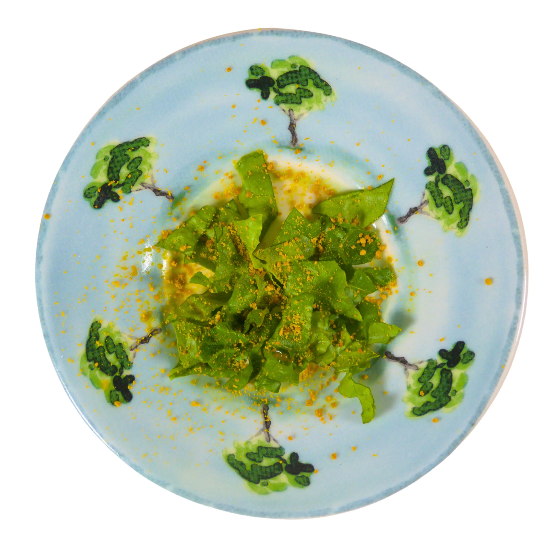 Leafy greens with powdered bee pollen added on as a topping. 